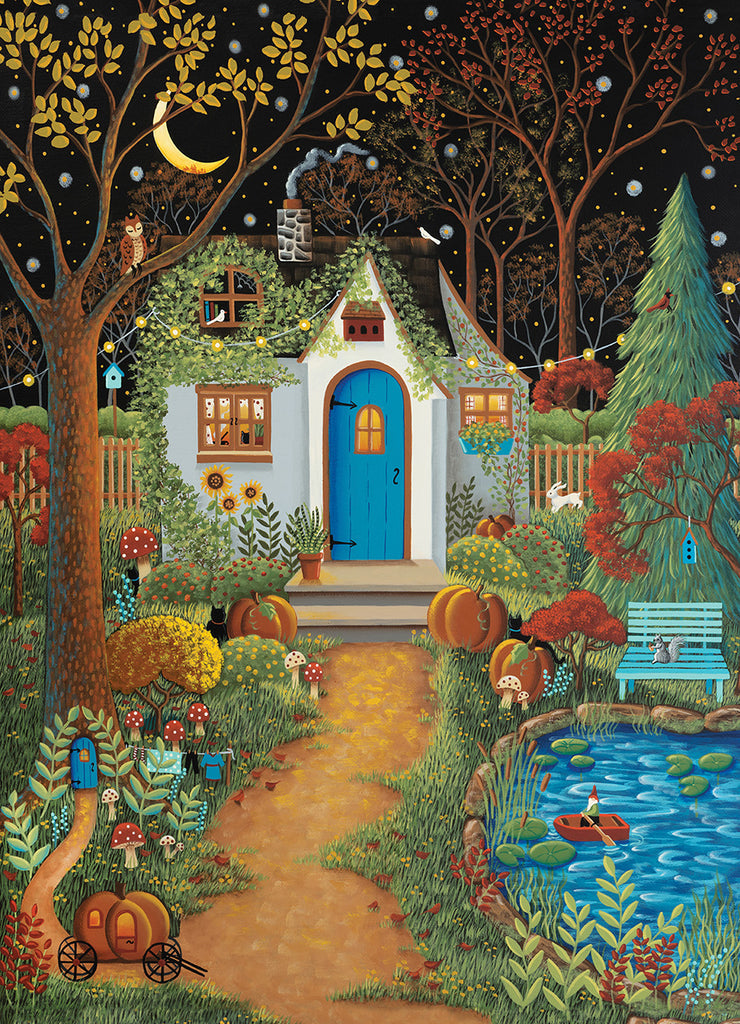 The PuzzleTwist Something's Amiss! Cozy Cottage 500 Piece puzzle by Mary Charles features a whimsical night scene with a blue-doored cottage, colorful trees and flowers, pumpkins, a pond, and a crescent moon.