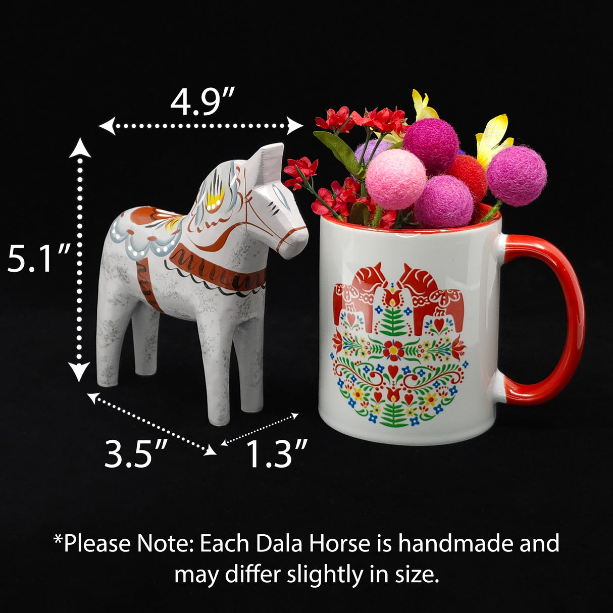 The "Love Horse" Karlekshast 13cm (5") white hand-carved Dala horse, symbolizing Swedish heritage décor, stands beside a mug with a red handle and pink pom-pom flowers; the mug has a 1.3" wide base.