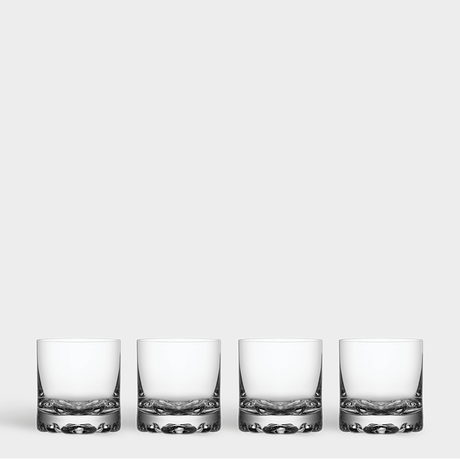 The Orrefors Erik Double Old Fashioned Glass 12oz (4-Pack) set features four pristine glasses arranged in a row on a plain background, highlighting their elegant clear glass design.