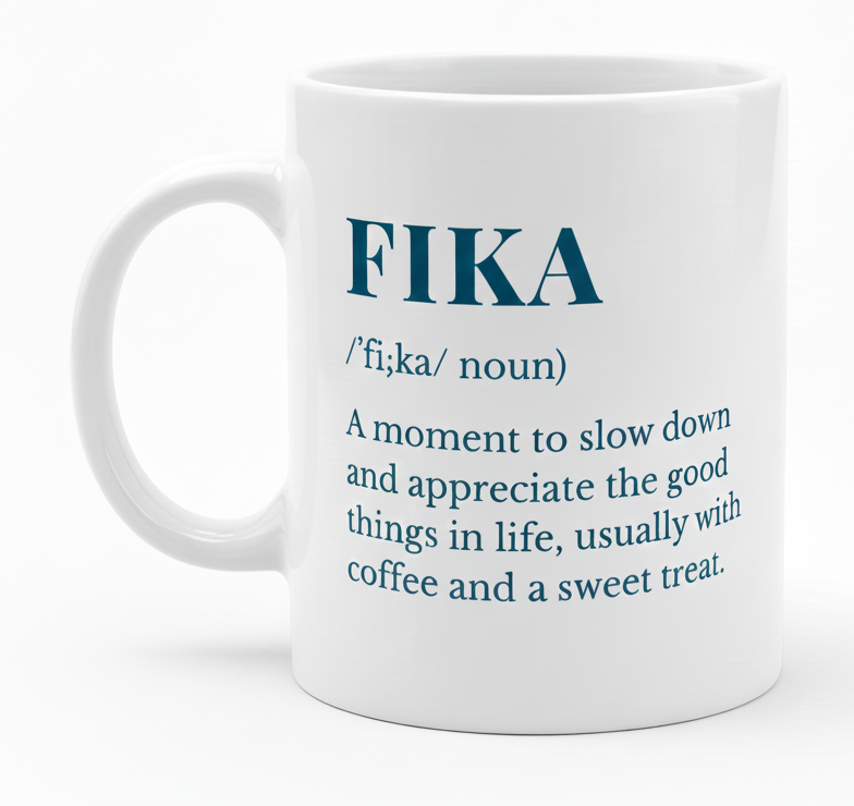The Coffee Mug: Fika Definition Coffee Mug (11oz) features the pronunciation and meaning of "fika" in blue text, celebrating Swedish appreciation for life, coffee, and treats—a thoughtful mindfulness gift.