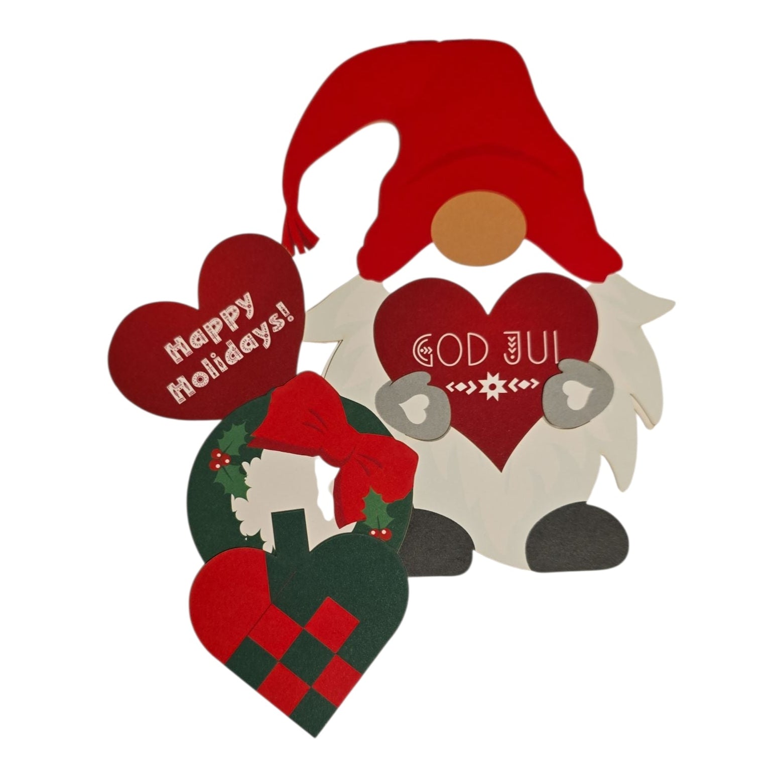 The Card: Tomte Holiday Card – Interchangeable Heart Design features a festive gnome holding a red heart with "God Jul", surrounded by a "Happy Holidays!" heart and a heart-shaped wreath on a white background.
