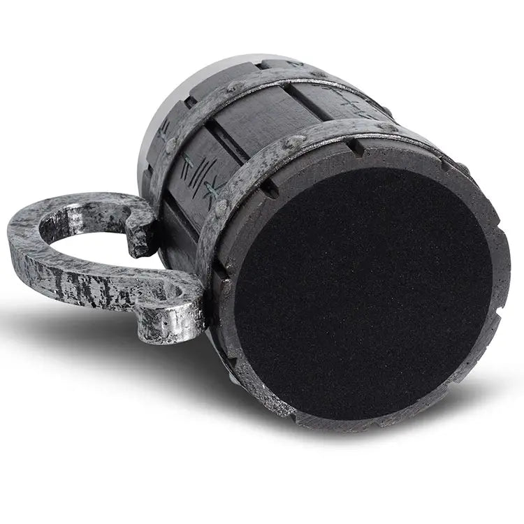 The Viking Runic Barrel Mug (20oz) boasts a gray metal stein design with a thick, round black cushioned base. It elegantly rests on its side, highlighting its large ornate handle and rugged charm with a resin exterior and stainless steel interior.