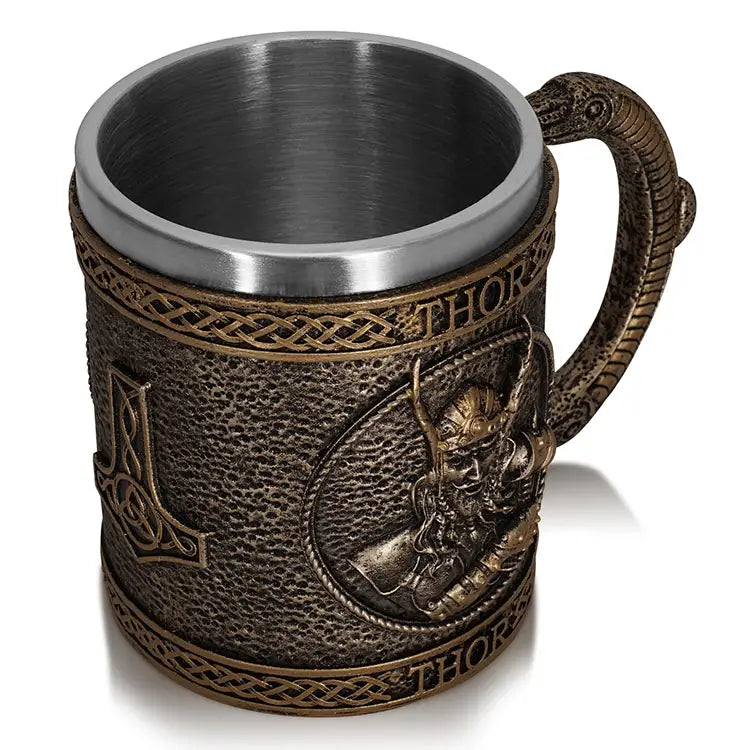 A Mug: Thor, God of Thunder & Lightning (15oz) showcases complex Norse-themed patterns with "Thor" tastefully engraved on the handle. Its resin exterior adds a distinct flair, and the stainless steel interior guarantees both durability and elegance with every drink.