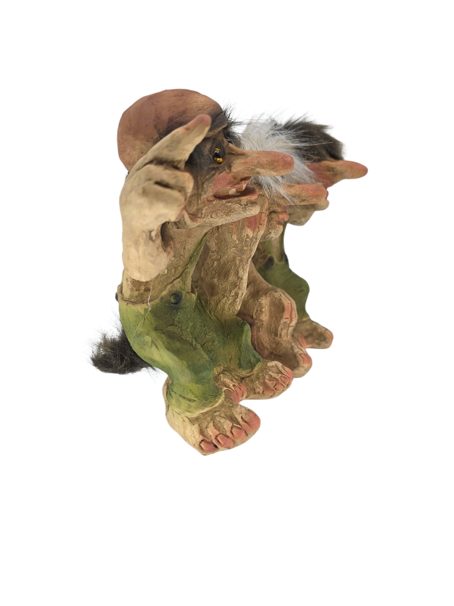 The “Three Pals” Troll Figurine by NyForm features a large nose, green pants, wild hair, and outstretched arms. This original Norwegian design (6.8" H × 11" L × 4" D) sits isolated on a white background.