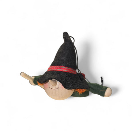 The Figurine: Kitchen Witch Handcrafted of Wood and Felt, 4.5" long, features a round head, black pointed hat, and outstretched arms—a charming Nordic decor accent and whimsical household guardian on any white background.