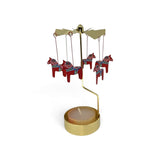 Gold-tone metal Dala horse candle holder with hanging red ornaments featuring blue and green rosemaling patterns that rotate when lit.