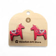 Red Dala Horse Stud Earrings with multi-colored Kurbits, celebrating Swedish heritage, are displayed on a card labeled Swedish Gift Store and evoke the charm of classic Nordic jewelry.