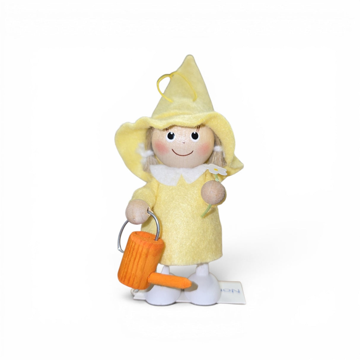 The Faire - Nordic Dreams Figurine: Scandinavian Tomte Girl in Yellow holds a watering can and flower—a charming, handcrafted gnome made in Scandinavia, perfect for adding Nordic flair to your home decor.