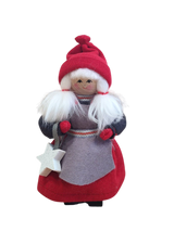 The Figurine: Santa Girl with Glittering Star features a handmade figure with white hair, red hat and dress, holding a glittering star—perfect Christmas décor for any space.
