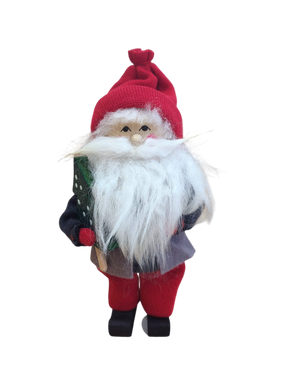 The Figurine: Santa with Glittering Tree is a handcrafted Swedish Santa with a red hat, bushy white beard, and red pants, holding a glittering green tree, set against a white background.