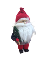 The Figurine: Santa with Glittering Tree features a handcrafted Swedish Santa in a red hat and suit with a white beard, holding a sparkling green Christmas tree—an ideal festive decoration, shown on a white background.