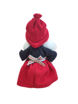 The "Figurine: Santa Girl with Glittering Star" features a handcrafted Swedish Santa girl in a red hat and skirt, navy blue top, and festive bow—a delightful Scandinavian Christmas décor piece shown from behind.