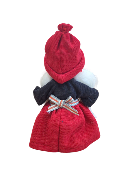 The "Figurine: Santa Girl with Glittering Star" features a handcrafted Swedish Santa girl in a red hat and skirt, navy blue top, and festive bow—a delightful Scandinavian Christmas décor piece shown from behind.
