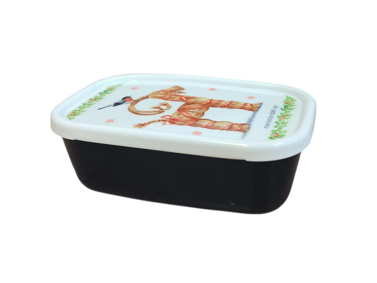 The Mini Christmas Box Container features Marie Stendahl designs, with a white lid showing a straw goat and bird, inspired by classic Swedish holiday décor.
