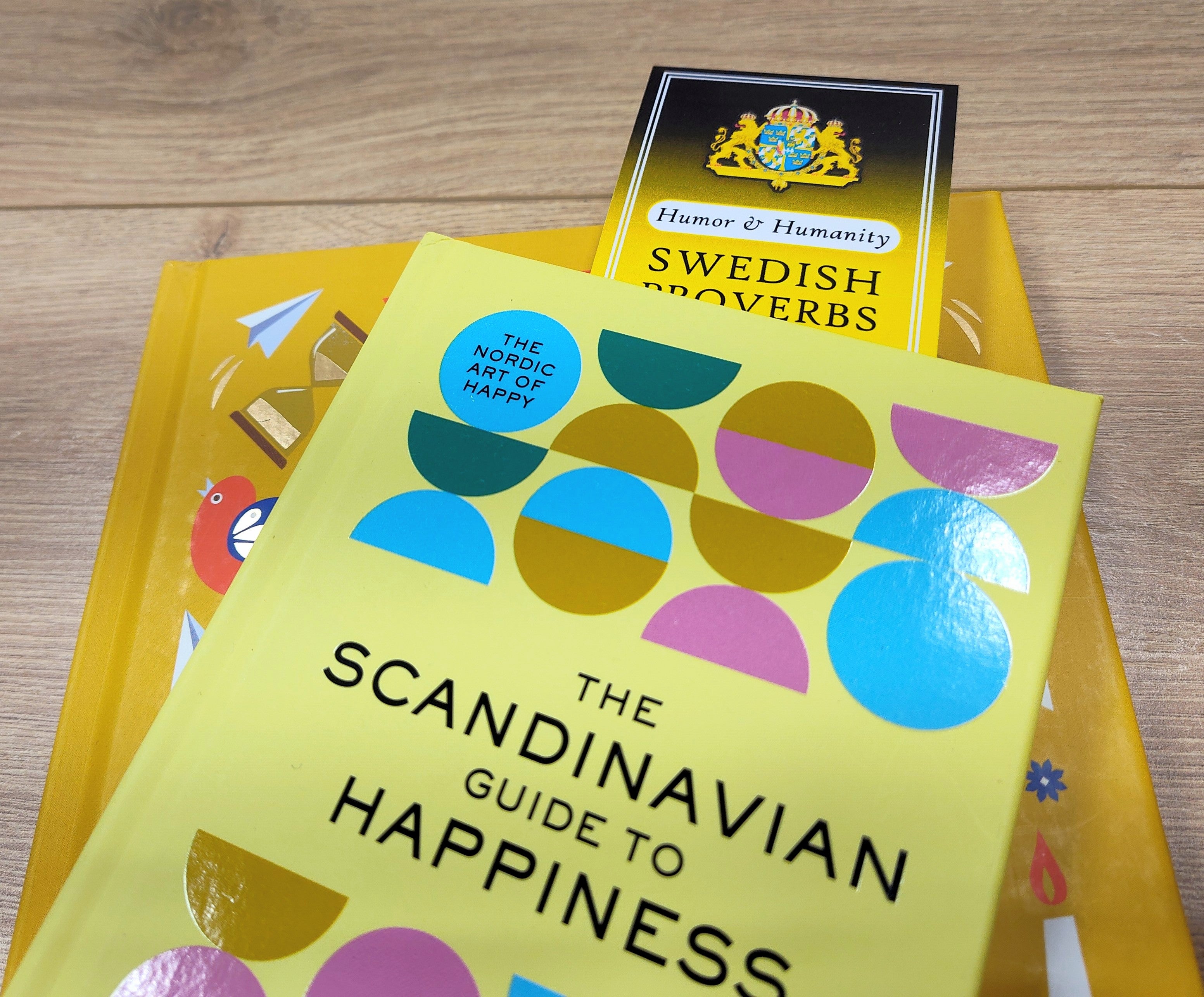 A Bookmark featuring Swedish Proverbs about "Humor & Humanity" (2.5" × 8.5")—perfect for anyone who appreciates wit and warmth in everyday life.