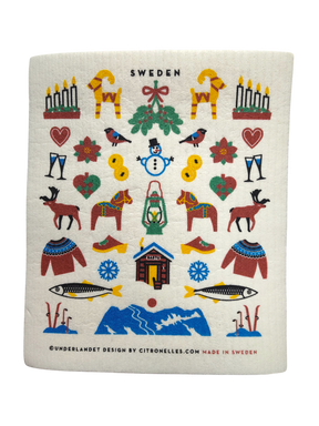The "Dishcloth: Swedish Winter Traditions" (8"x7") features folk art Dala horses, candles, hearts, birds, and more in a charming Nordic design—an eco-friendly cotton/cellulose blend perfect for your kitchen.