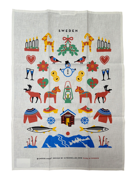 The Tea Towel: Swedish Winter Traditions—cotton/linen blend (50×70 cm)—features colorful Swedish folk motifs and “Sweden” at the top; a charming Scandinavian gift inspired by Sweden’s winter heritage.