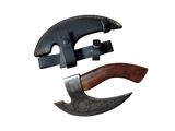 The Titan Nordic Raven Pizza Cutter features Norse-inspired craftsmanship, a wooden handle, hand-forged blade, and comes with a black leather hand axe sheath with yellow stitching, shown on a white background. Approx. 12" × 6".