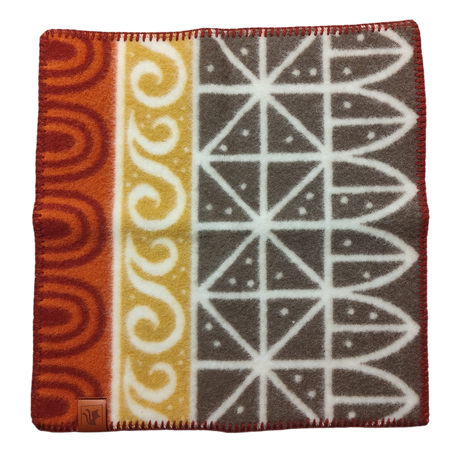 Wool Seat Pad: Uppsala Rust by Kerstin Landström features geometric and wave patterns in red, yellow, and gray. Made from OEKO-TEX certified lambswool for premium softness, it includes a leather tag in one corner.