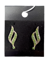 A pair of Earrings: August Peridot Swarovski® Crystals Spiral Dangle Earrings with green gemstones in a spiral design, displayed on a black card.