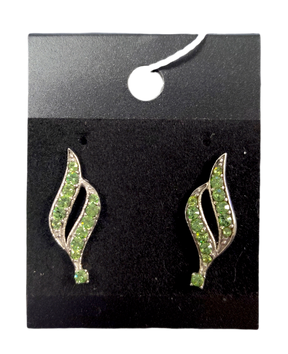 A pair of Earrings: August Peridot Swarovski® Crystals Spiral Dangle Earrings with green gemstones in a spiral design, displayed on a black card.