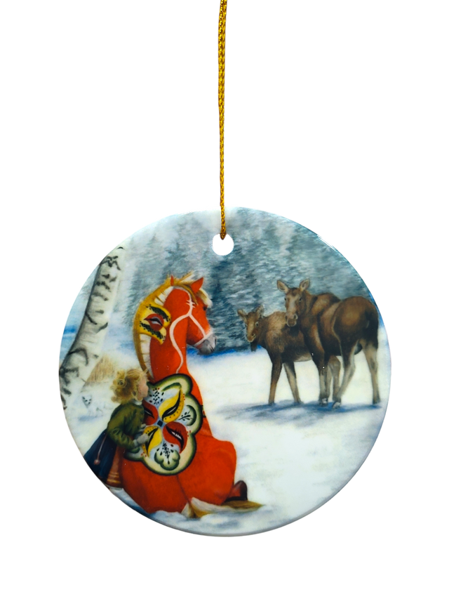 The Ornament: Dala Horse and Moose Ceramic Ornament features a round ceramic design with a child, horse, and two deer in a snowy forest, hung by a gold string—a charming Nordic-inspired Christmas decoration for your tree.