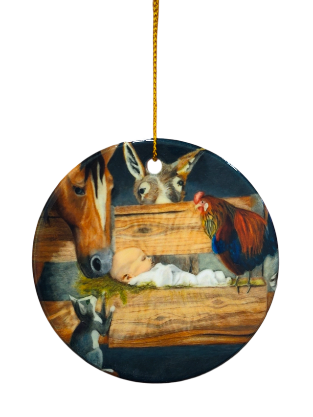 The Ornament: Manger Scene with Barn Animals and Baby Jesus Ceramic Ornament features baby Jesus in a manger, surrounded by a horse, donkey, rooster, and goat, with a gold hanging string at the top.
