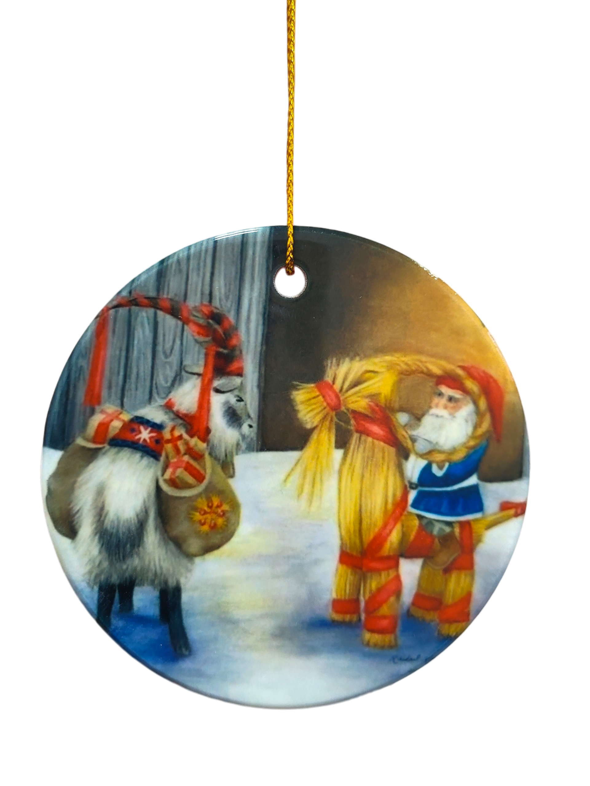 The Ornament: Tomte and Yule Goat Ceramic Ornament features a round Scandinavian design with a festive goat and Tomte on snow beside a straw Yule Goat, hanging by a gold string.