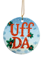 The Ornament: Uff Da Ceramic Ornament features "UFF DA" in red, holly leaves and berries, blue snowflake background, and a gold hanging string—a charming Scandinavian holiday décor piece.