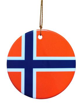 The Ornament: Iceland Flag Ceramic Ornament is a round ceramic ornament displaying the Icelandic flag, with a blue cross outlined in white on a red background, hanging from a gold string—perfect for celebrating Icelandic heritage.