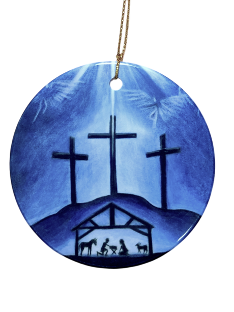 The Ornament: Blue Crosses Ceramic Ornament features three crosses on a hill above a nativity scene, set against a blue background and finished with a gold hanging string—a meaningful religious decoration for your Christmas tree.