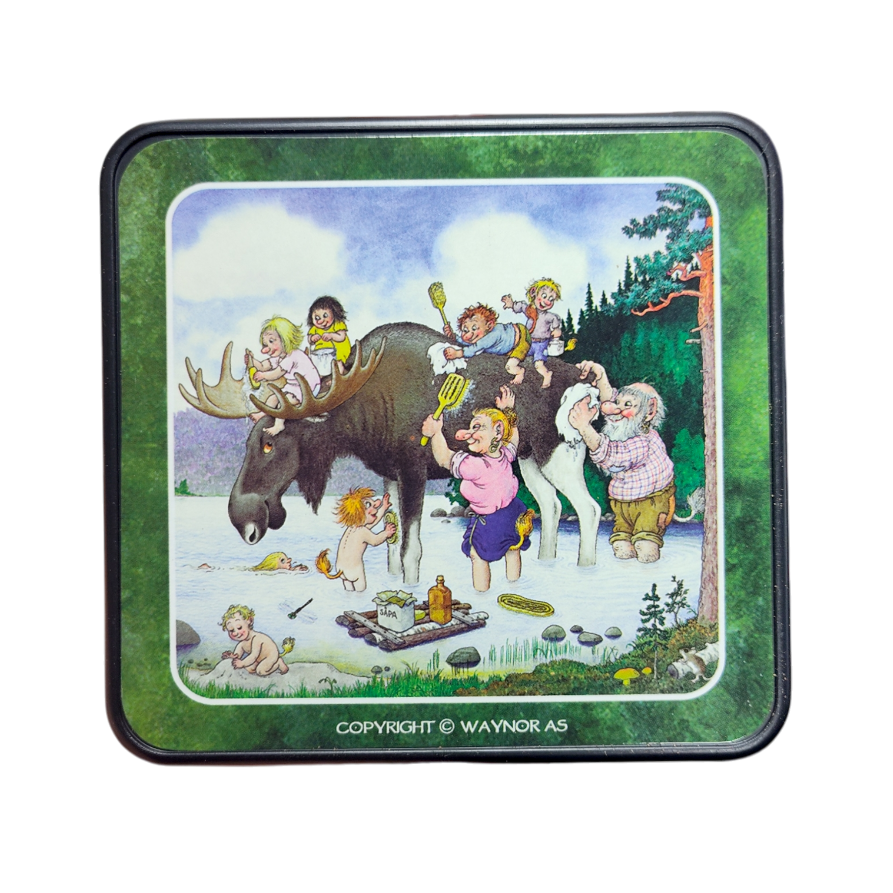 Whimsical scene inspired by the Rolf Lidberg Collection: children and adults play around a moose by a lake with picnic items, set among trees. Perfect for fans of Scandinavian folklore—featured on Troll Norway Rolf Lidberg Collection Coasters (4-Pack).