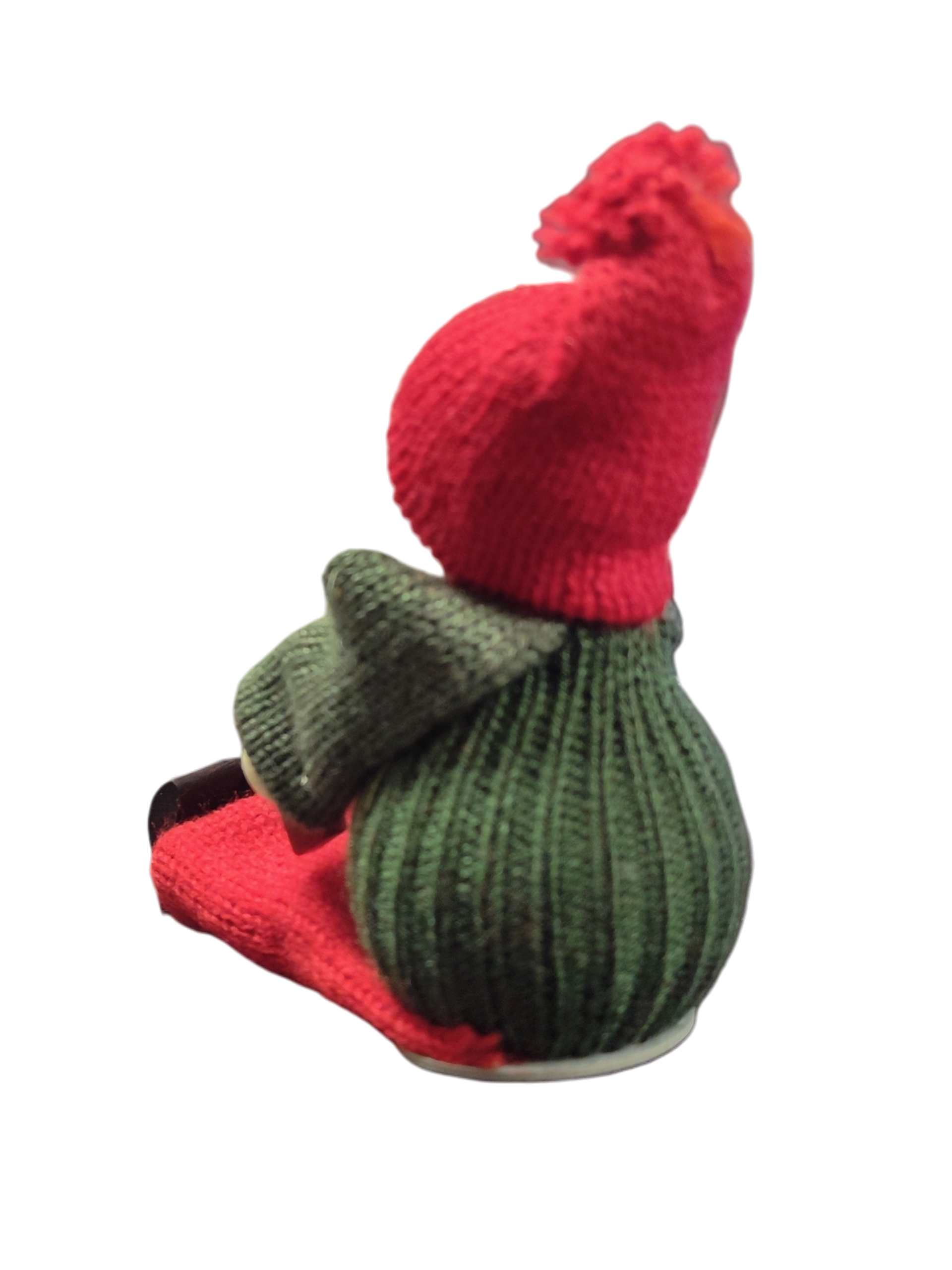 The Figurine: Handcrafted Swedish Santa Boy Sitting with Red Dala Horse features a green body, red hat and scarf, capturing classic Swedish Christmas decor. Photographed against a white background.