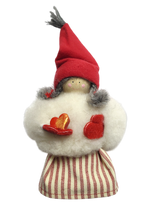 The Figurine: Sheepskin Tomte "Gnome" Holding a Heart features a small Scandinavian gnome with a red hat, gray braids, and fluffy white top—ideal Swedish table decor.