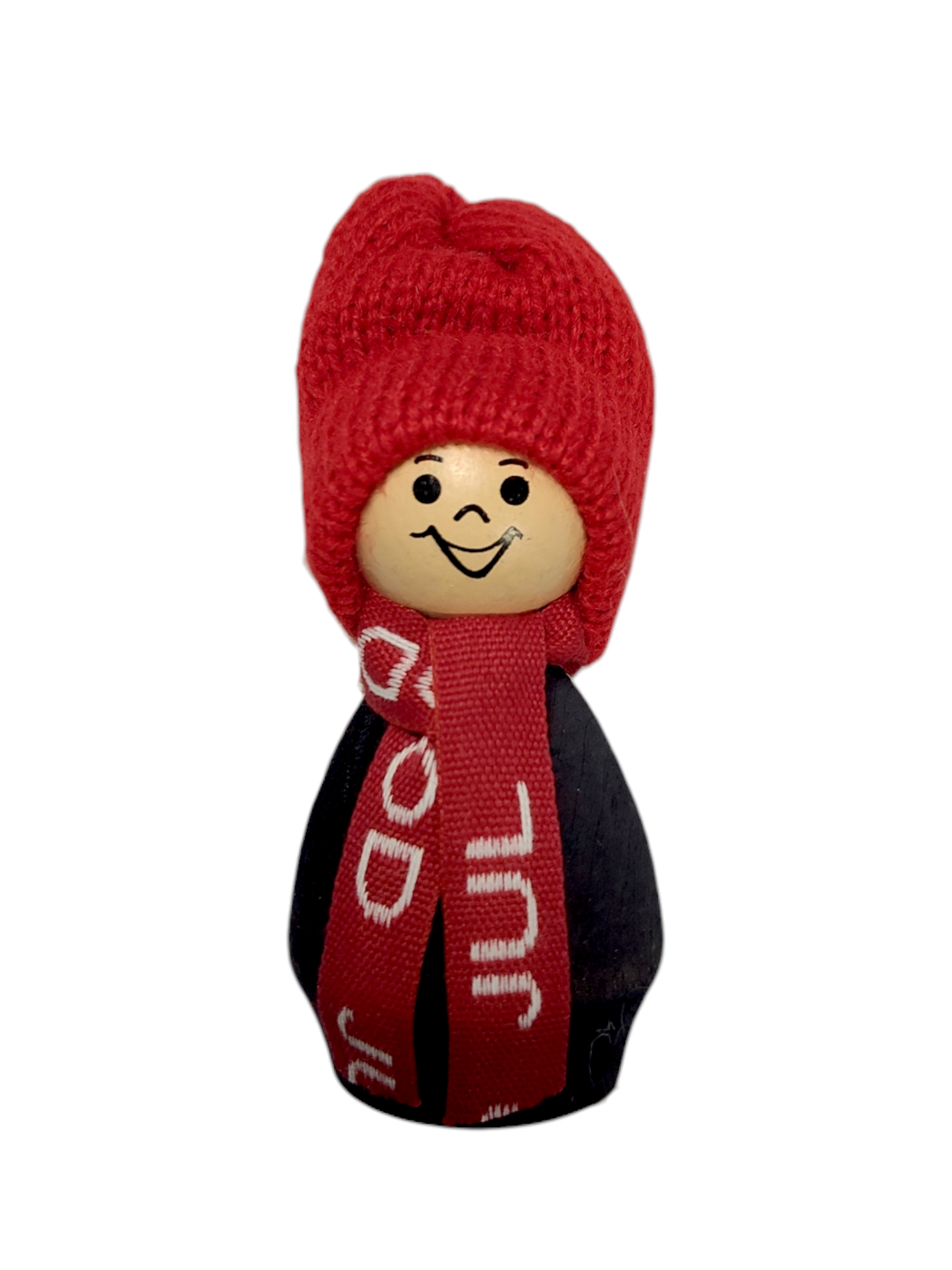 The Figurine: Boy in Red Hat Handmade in Sweden features a smiling wooden face, red knit hat, and red scarf with white text, creating a charming Nordic Christmas decoration against a white background.