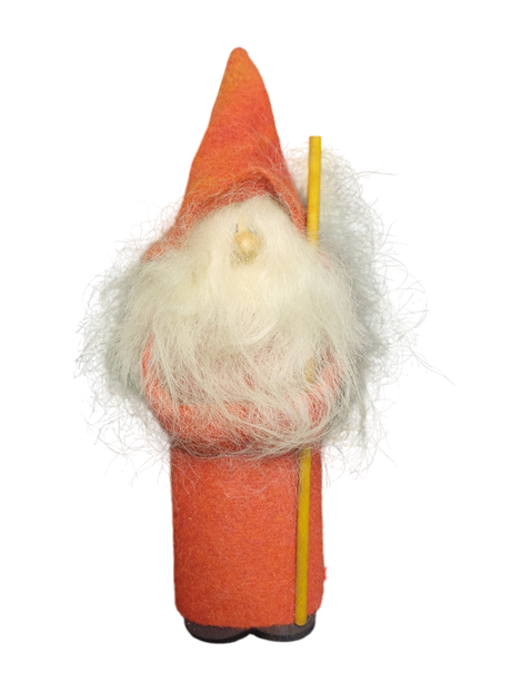 A small gnome figurine called "Figurine: Gnome with Tall Red Hat," featuring a long white beard and red hat, is perfect for adding unique holiday décor to your home.
