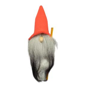 The Tomte figurine is a handmade Scandinavian Santa with a tall red hat, long grey beard, round nose, and holds a long wooden stick. Stands 10.5" tall.