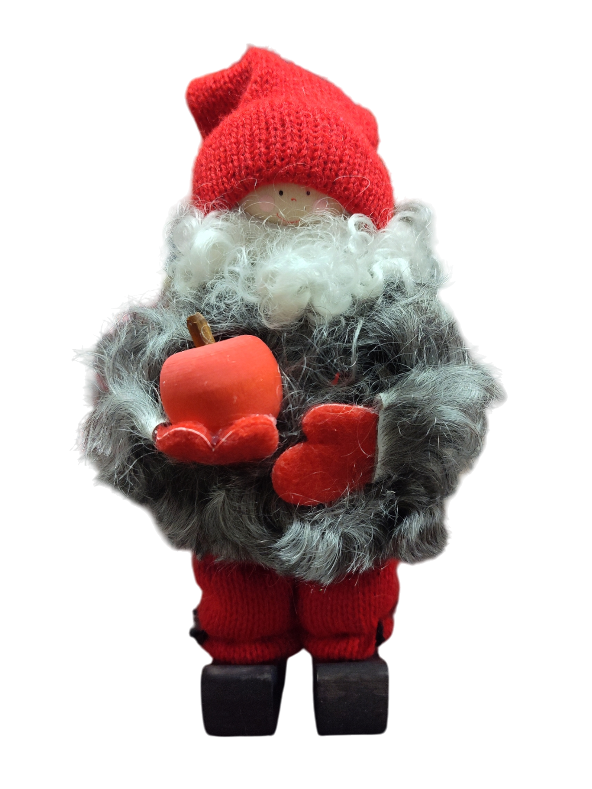 The Figurine: Tomte with Apple and Knit Pants features a small Tomte in red and gray knit clothes with faux fur trim, holding a red apple—ideal for adding Scandinavian charm to your holiday décor.