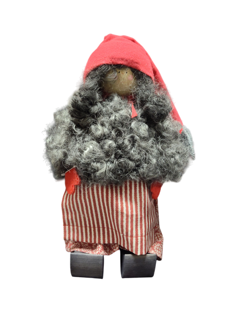The Santa Figurine 11" is a handmade doll with a curly gray beard, red hat and mittens, striped red and white skirt, and wooden shoes—perfect for holiday decor and standing against a white background.