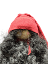 The Santa Figurine 11" features a handmade design with a curly gray beard, red hat, and scarf, set against a white background—an ideal holiday accent to bring festive charm to your space.