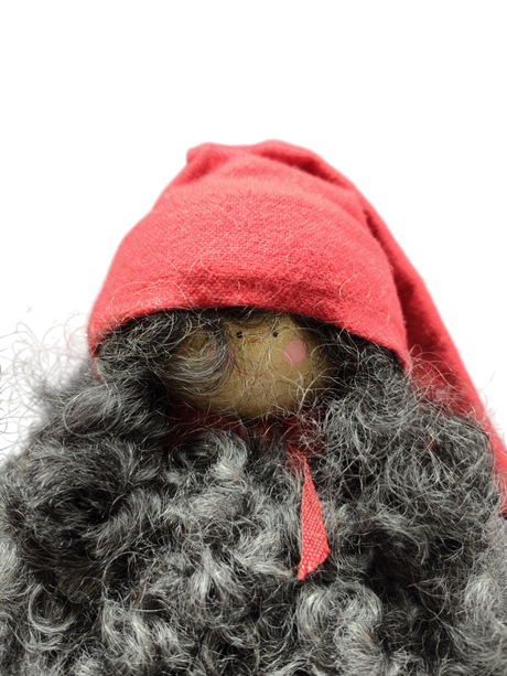 The Santa Figurine 11" features a handmade design with a curly gray beard, red hat, and scarf, set against a white background—an ideal holiday accent to bring festive charm to your space.