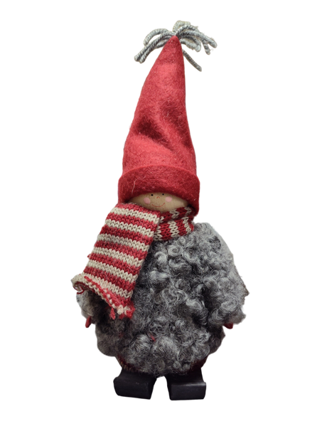 The Santa Boy and Girl Figurine 11" features plush details—a red pointed hat, striped scarf, gray curly body, and black boots—perfect Scandinavian-inspired holiday decor for any space.