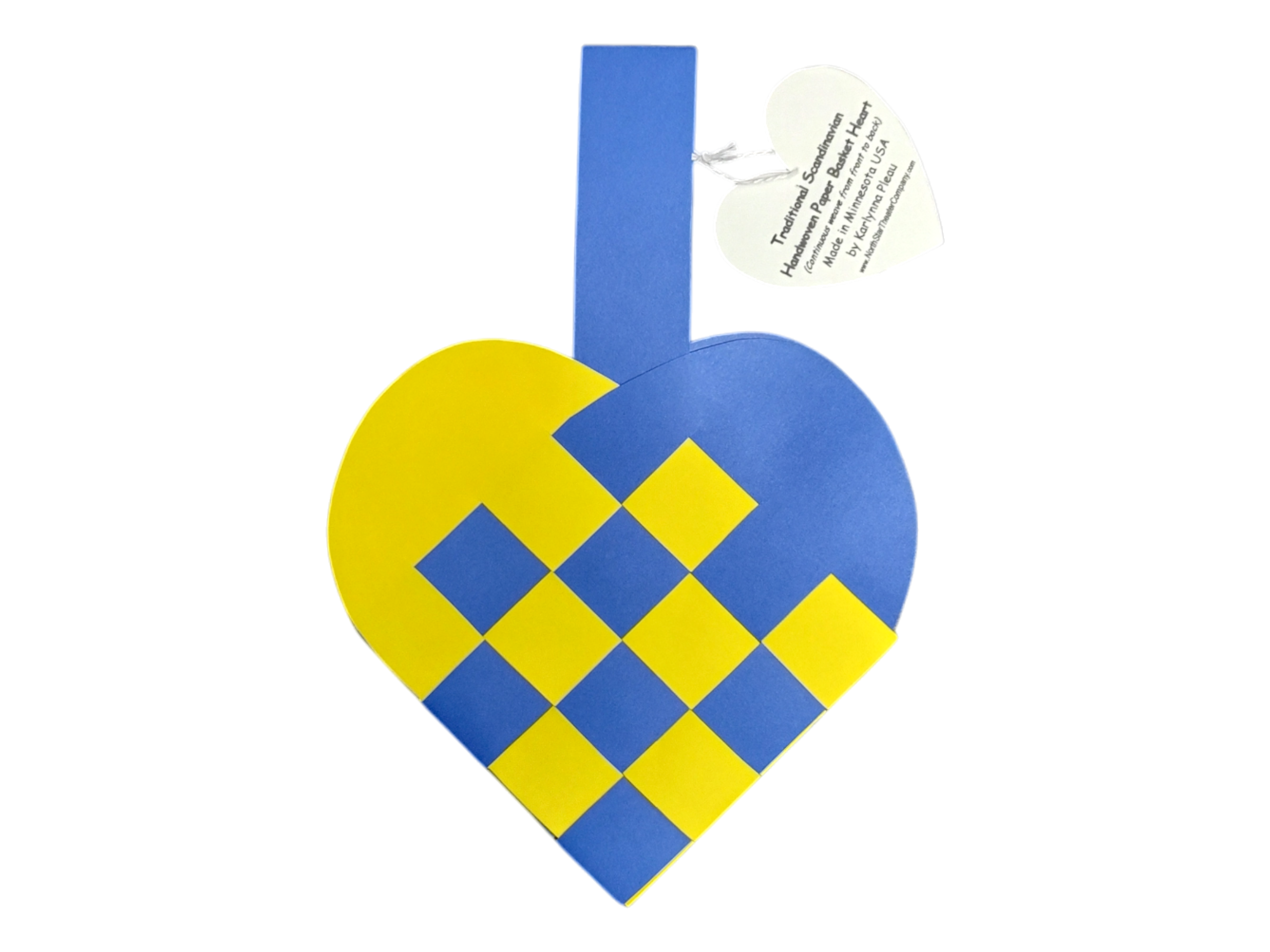 The Card: Swedish Flag Traditional Scandinavian Handwoven Paper Basket Heart features a blue and yellow handwoven heart basket with a handle and a heart-shaped tag displaying printed text.