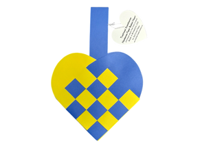 The Card: Swedish Flag Traditional Scandinavian Handwoven Paper Basket Heart features a blue and yellow handwoven heart basket with a handle and a heart-shaped tag displaying printed text.