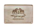 The Cutting Board: Var Sa God Maple Cutting Board (9"x6") features an engraved Scandinavian design and the phrase "Var så god" in script, making it a charming addition to any Scandinavian kitchen decor.