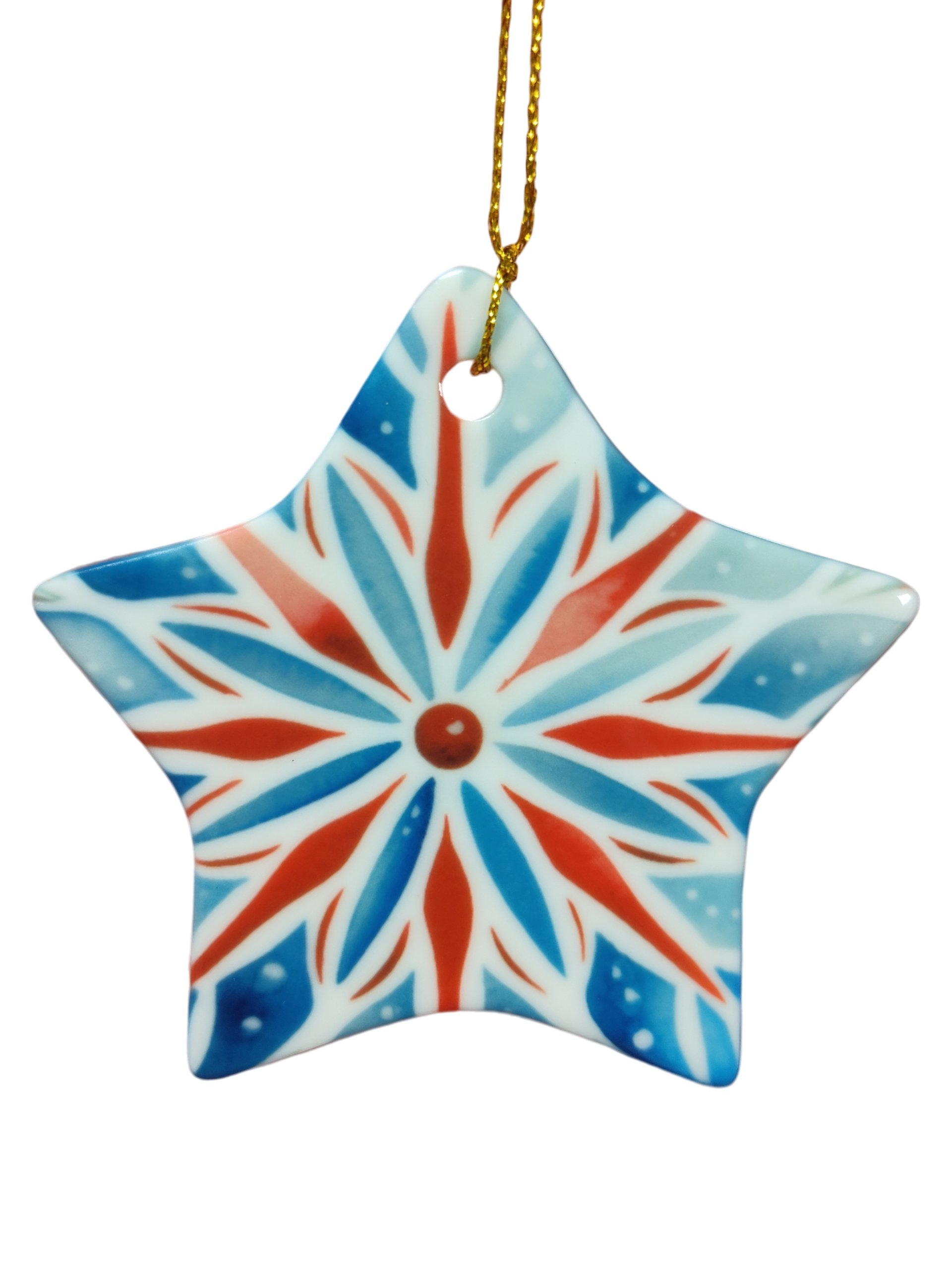 The Ornament: Red, White, and Blue Rosemaling Star Ceramic Ornament features a Scandinavian-inspired geometric pattern and hangs elegantly from a gold string.