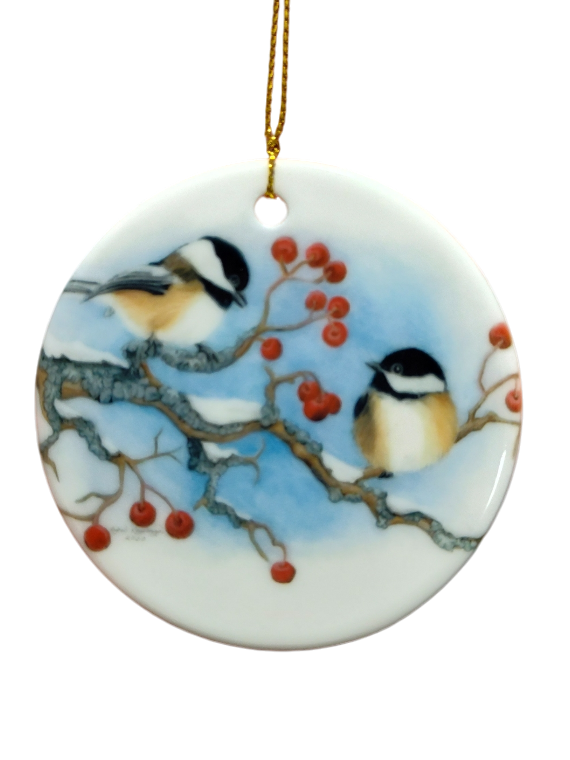 The Ornament: Winter Chickadees Ceramic Ornament features two chickadees on snowy branches with red berries, accented by a gold hanging string—a delightful bird-themed Christmas decoration for your tree.