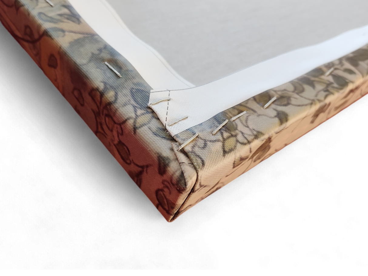 Close-up of the back corner of "Artwork: The Crayfish Season Opens Carl Larsson 1897 Print on Canvas" showing the fabric neatly stapled to the wooden frame with visible folds.