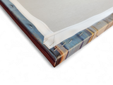 Close-up of the back corner of "Artwork: Bedroom in Arles Vincent Van Gogh 1853 - 1890 Print on Canvas," showing folded and stapled edges secured to a wooden frame.