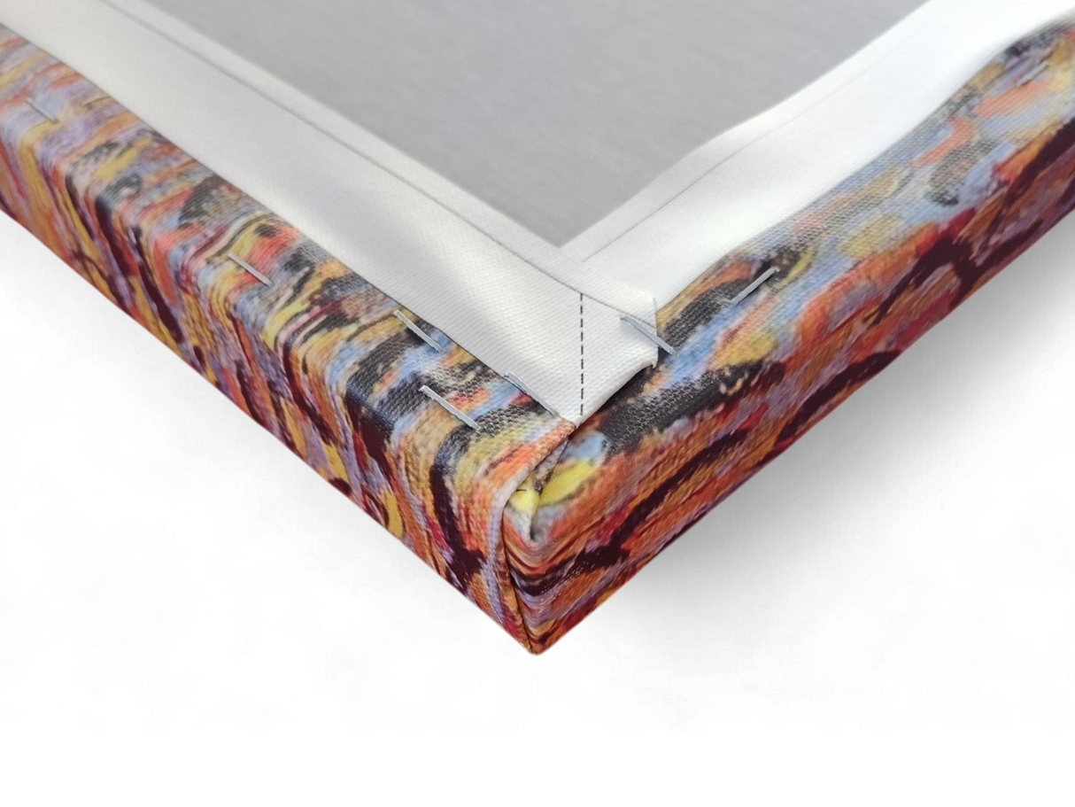 Close-up of a stretched "Café Terrace at Night" by Vincent Van Gogh canvas print, showing the vibrant colors and the neatly folded and stapled corner on its wooden frame.